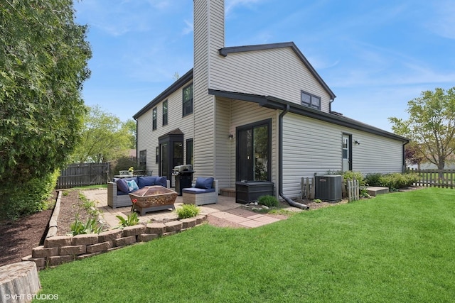 1900 Buckingham Rd, Mundelein, IL 60060 - rear view of property with a patio area, central air condition unit, a chimney, and an outdoor living space with a fire pit