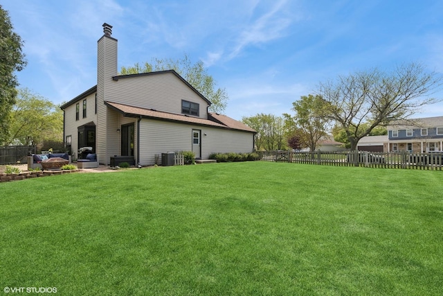 1900 Buckingham Rd, Mundelein, IL 60060 - rear view of house featuring central air condition unit and a chimney