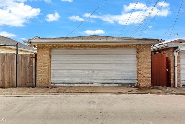 garage with fence