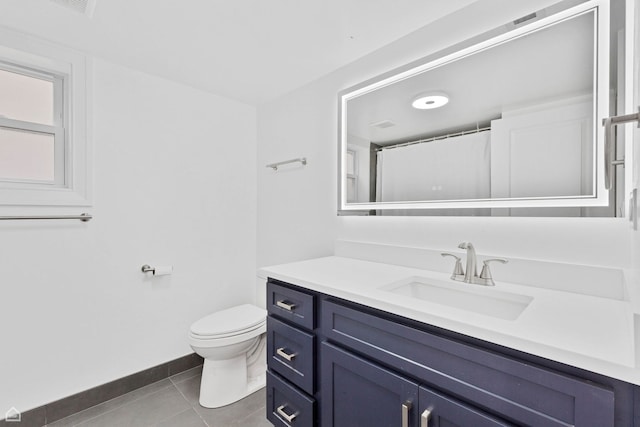 full bathroom featuring vanity, toilet, tile patterned flooring, and baseboards