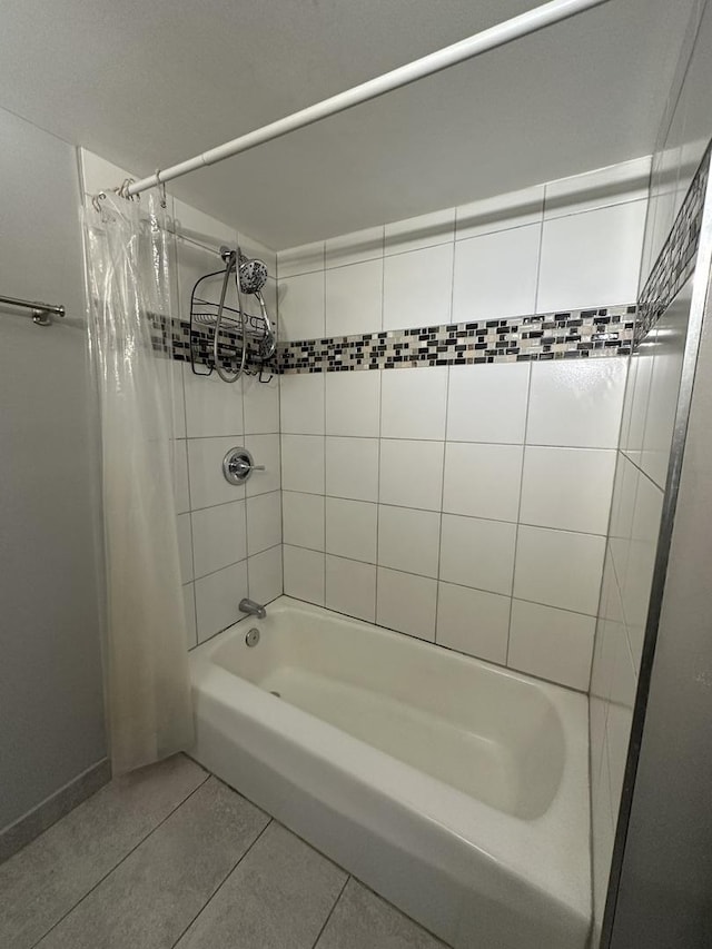 bathroom with tile patterned floors and shower / bath combination with curtain