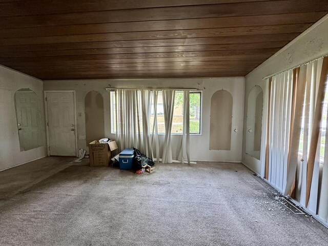 311 Seneca St, Park Forest, IL 60466 - carpeted empty room featuring wood ceiling and arched walkways