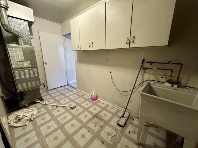 311 Seneca St, Park Forest, IL 60466 - laundry room featuring light flooring and cabinet space