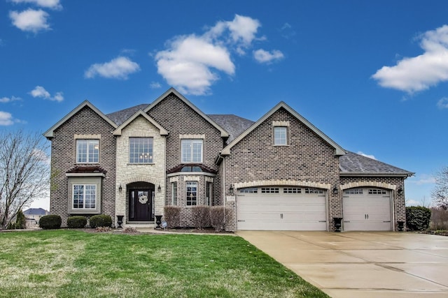 22814 Sara Springs Dr, Frankfort, IL 60423 - view of front facade featuring brick siding, concrete driveway, a front yard, a garage, and roof with shingles