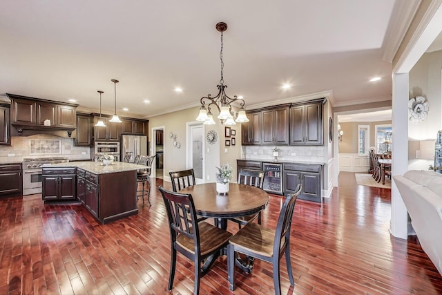22814 Sara Springs Dr, Frankfort, IL 60423 - dining area featuring crown molding, dark wood finished floors, recessed lighting, and a chandelier
