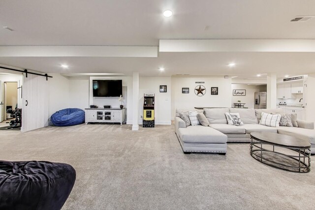 22814 Sara Springs Dr, Frankfort, IL 60423 - carpeted living area featuring a barn door and recessed lighting