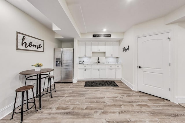 22814 Sara Springs Dr, Frankfort, IL 60423 - kitchen featuring stainless steel fridge, a sink, white cabinets, light wood-type flooring, and recessed lighting