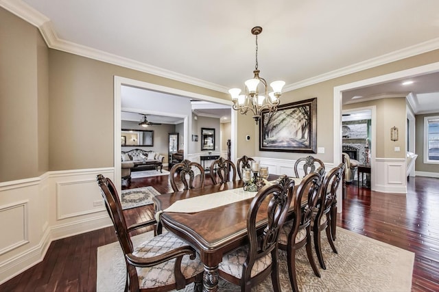 22814 Sara Springs Dr, Frankfort, IL 60423 - dining area featuring wood-type flooring, crown molding, a chandelier, wainscoting, and a decorative wall