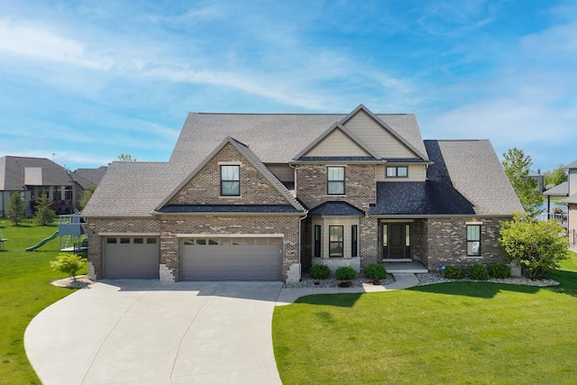 3605 Como Ct, Normal, IL 61761 - craftsman-style house with concrete driveway, a front lawn, brick siding, and a playground