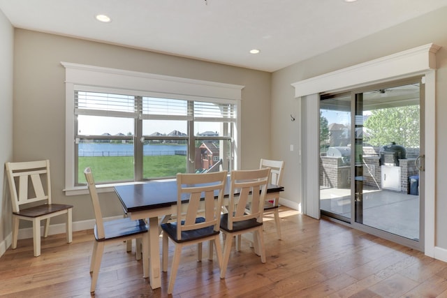 3605 Como Ct, Normal, IL 61761 - dining area featuring light wood-style floors, recessed lighting, a water view, and baseboards