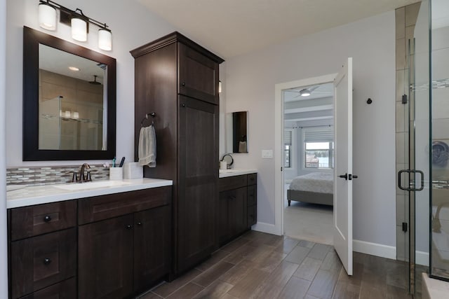 3605 Como Ct, Normal, IL 61761 - bathroom with a stall shower, backsplash, two vanities, and baseboards