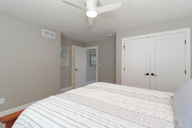 3605 Como Ct, Normal, IL 61761 - bedroom with baseboards, a closet, ceiling fan, and a textured ceiling