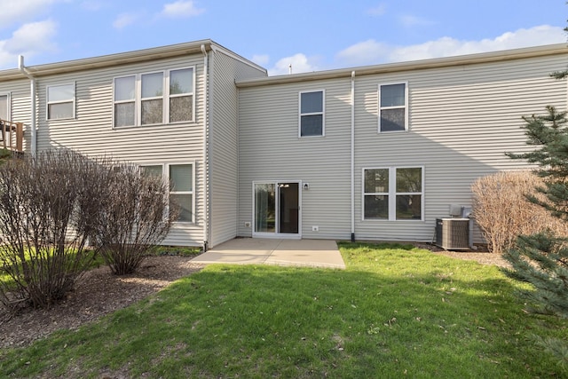 back of house with a yard, a patio, and central AC unit