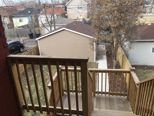 deck featuring a fenced backyard and a residential view