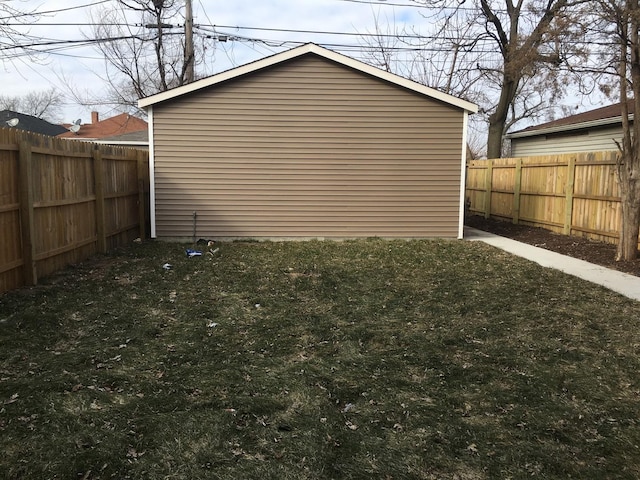 view of outbuilding featuring a fenced backyard