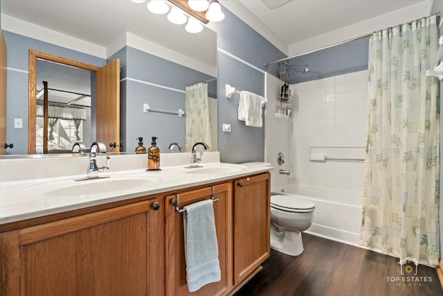 full bathroom featuring double vanity, shower / tub combo, a sink, and wood finished floors