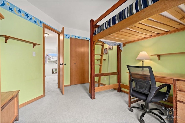 office space with baseboards and carpet