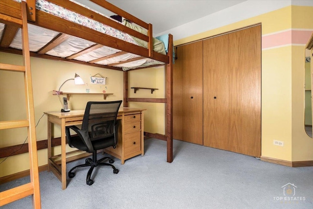 carpeted office with baseboards