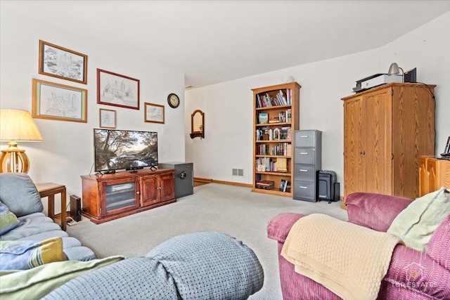living area featuring carpet, visible vents, and baseboards