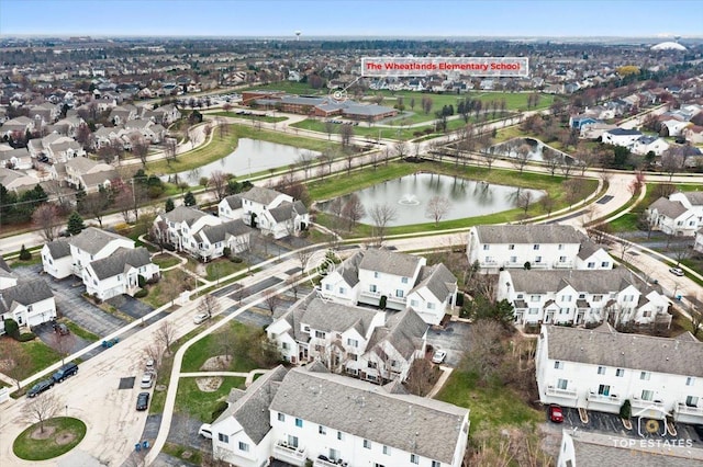 bird's eye view featuring a water view and a residential view