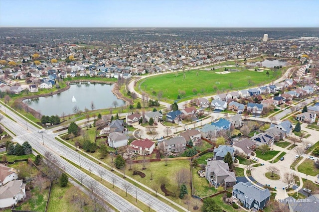 birds eye view of property with a water view and a residential view