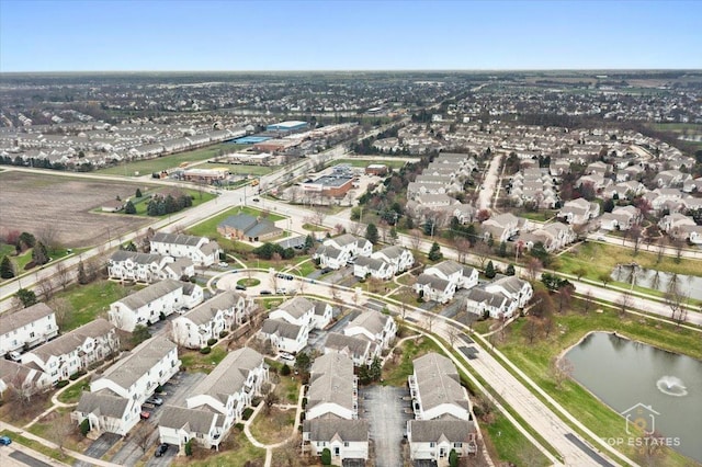 birds eye view of property featuring a water view and a residential view