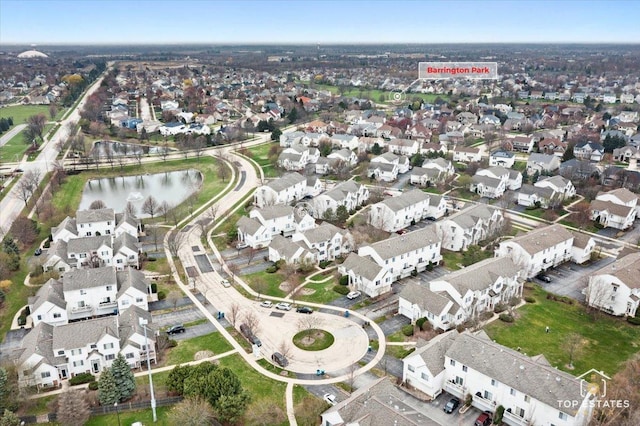 drone / aerial view with a water view and a residential view