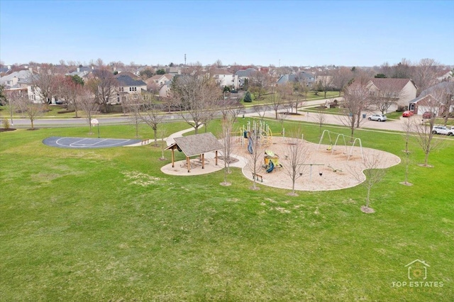 exterior space with playground community, a residential view, and a lawn