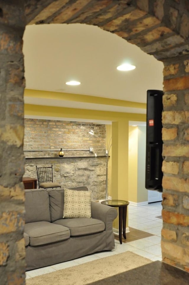 living room with light tile patterned floors, baseboards, and recessed lighting