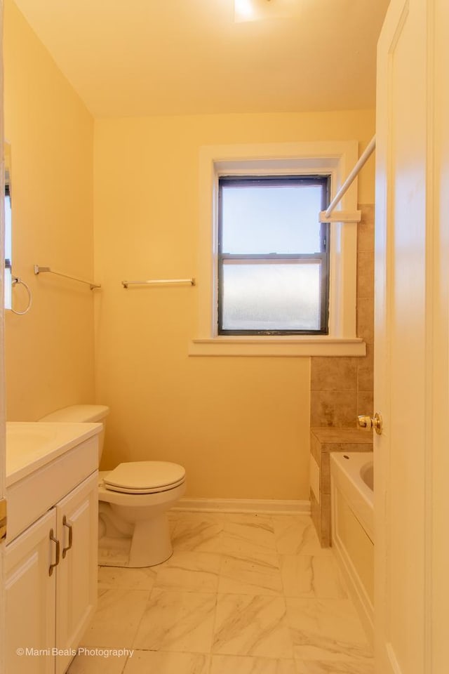 full bathroom with toilet, shower / tub combination, marble finish floor, and vanity