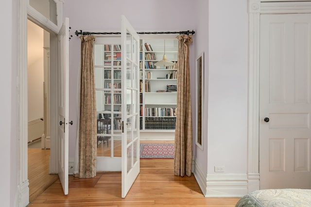 interior space featuring light wood-style floors and french doors
