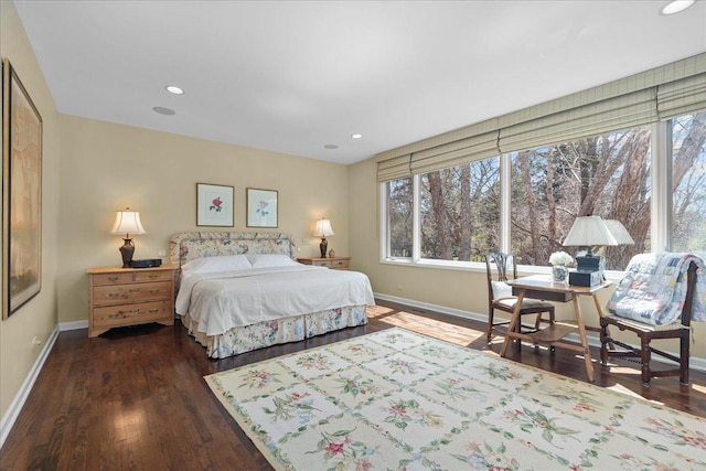 bedroom with baseboards, wood finished floors, and recessed lighting