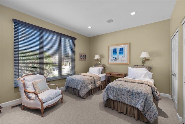 carpeted bedroom with baseboards, a closet, visible vents, and recessed lighting
