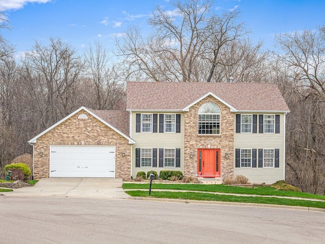 2072 Charnwood Ct, Machesney Park, IL 61115 - colonial-style house with driveway and an attached garage