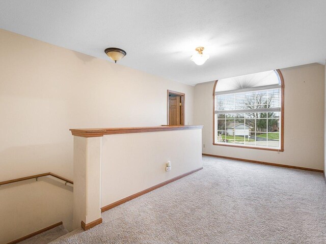 2072 Charnwood Ct, Machesney Park, IL 61115 - spare room featuring baseboards and carpet floors