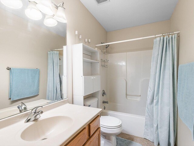 2072 Charnwood Ct, Machesney Park, IL 61115 - bathroom with shower / bathtub combination with curtain, vanity, visible vents, toilet, and tile patterned floors