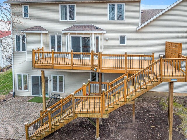 2072 Charnwood Ct, Machesney Park, IL 61115 - back of house with a patio, stairway, a wooden deck, and a shingled roof