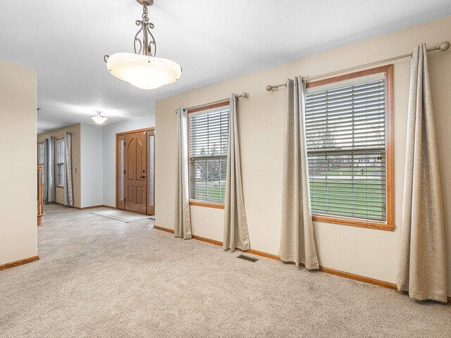 2072 Charnwood Ct, Machesney Park, IL 61115 - unfurnished room with visible vents, baseboards, and carpet floors
