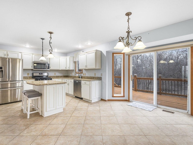 2072 Charnwood Ct, Machesney Park, IL 61115 - kitchen featuring visible vents, appliances with stainless steel finishes, a chandelier, and light tile patterned flooring