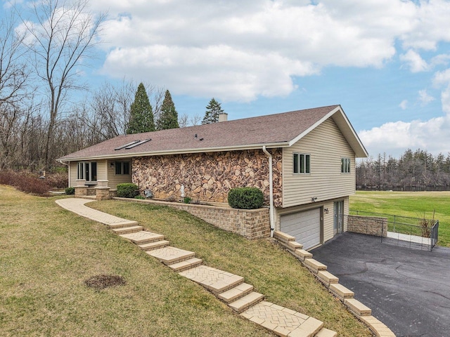 34550 N Stanley Rd, Ingleside, IL 60041 - view of front facade featuring a front lawn, an attached garage, a chimney, a shingled roof, and driveway