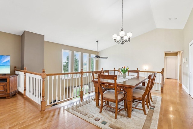 34550 N Stanley Rd, Ingleside, IL 60041 - dining room featuring vaulted ceiling, light wood-style floors, and ceiling fan with notable chandelier
