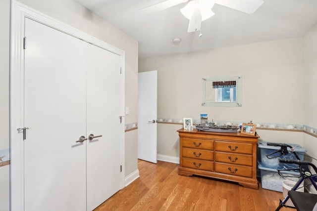 34550 N Stanley Rd, Ingleside, IL 60041 - bedroom featuring ceiling fan, baseboards, a closet, and light wood-type flooring