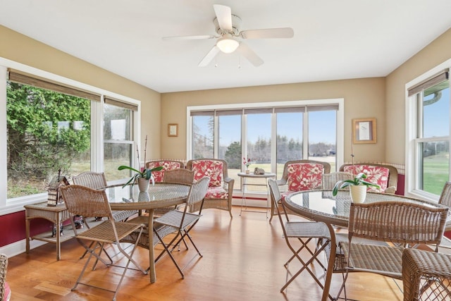 34550 N Stanley Rd, Ingleside, IL 60041 - dining room featuring light wood-style flooring, ceiling fan, and a wealth of natural light