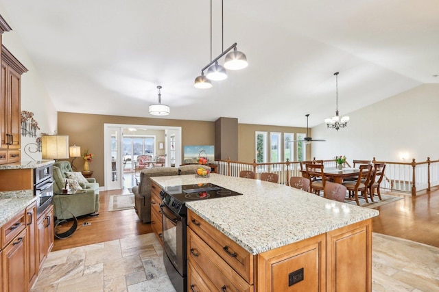 34550 N Stanley Rd, Ingleside, IL 60041 - kitchen with light stone counters, black electric range, lofted ceiling, open floor plan, and brown cabinets