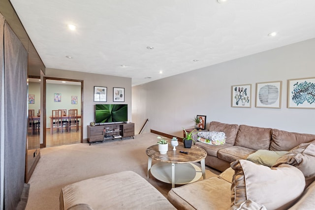 living room with recessed lighting and carpet floors