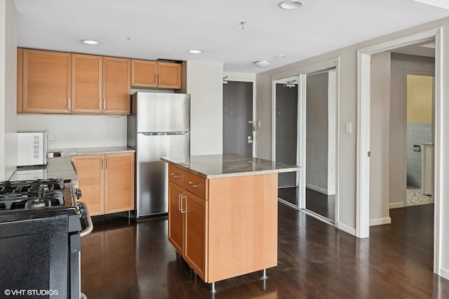 1150 N Lake Shore Dr Unit 20J, Chicago, IL 60611 - kitchen featuring dark wood-style flooring, baseboards, recessed lighting, a kitchen island, and appliances with stainless steel finishes