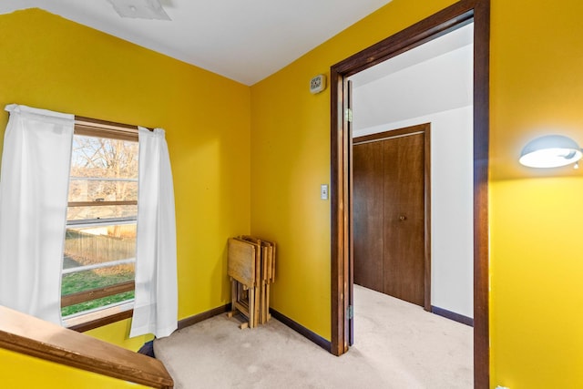 interior space with a closet and baseboards