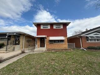 11531 S Throop St, Chicago, IL 60643 - view of front of home with a front lawn