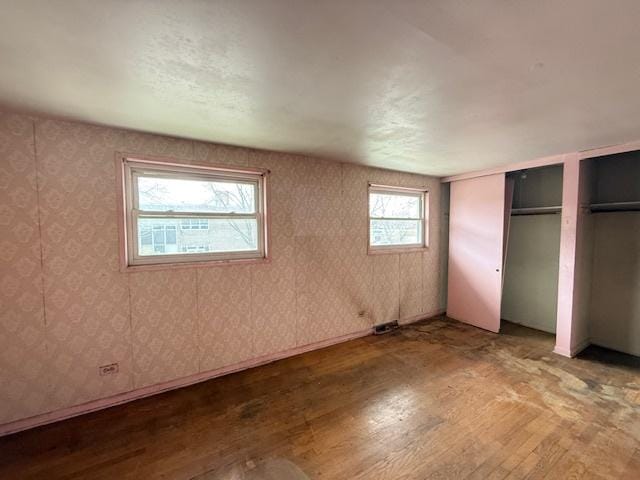 11531 S Throop St, Chicago, IL 60643 - unfurnished bedroom featuring two closets and wood finished floors