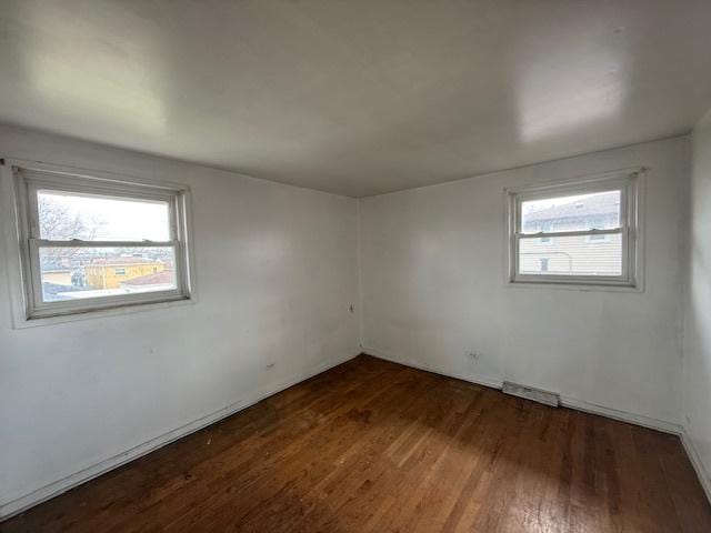 11531 S Throop St, Chicago, IL 60643 - unfurnished room with a healthy amount of sunlight, visible vents, and wood finished floors